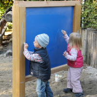 Colouring wall with liquid crayons for toddlers