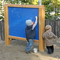 Colouring wall with liquid crayons for toddlers