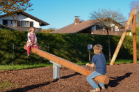 See-saw with shock absorbers
